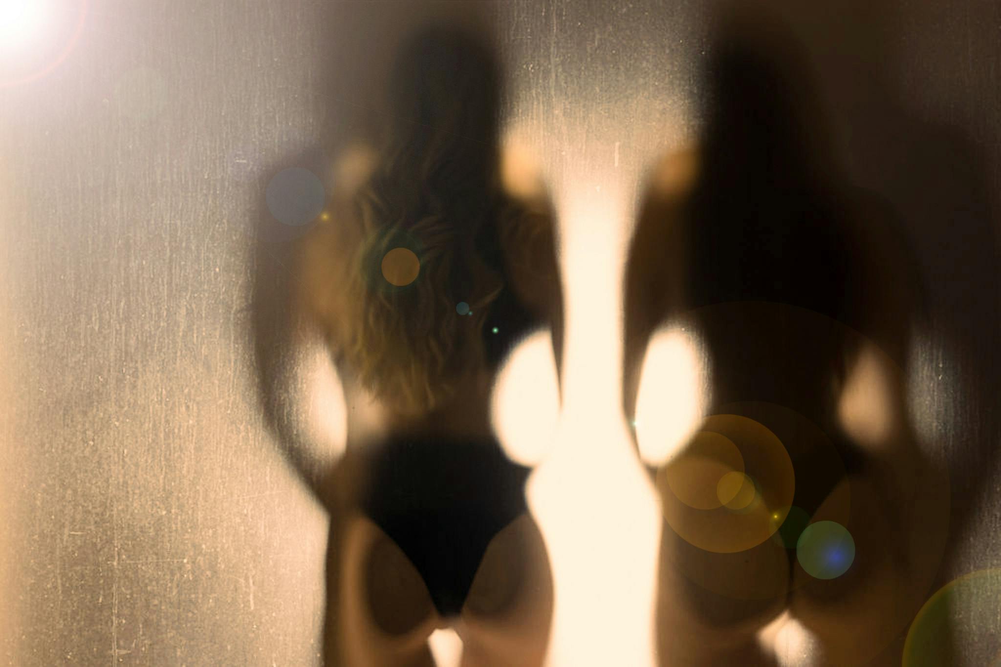 Silhouette of two women.