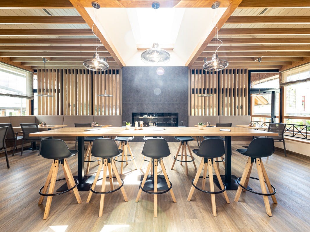 The dining room in the Schaffelbad with a view of the fireplace.