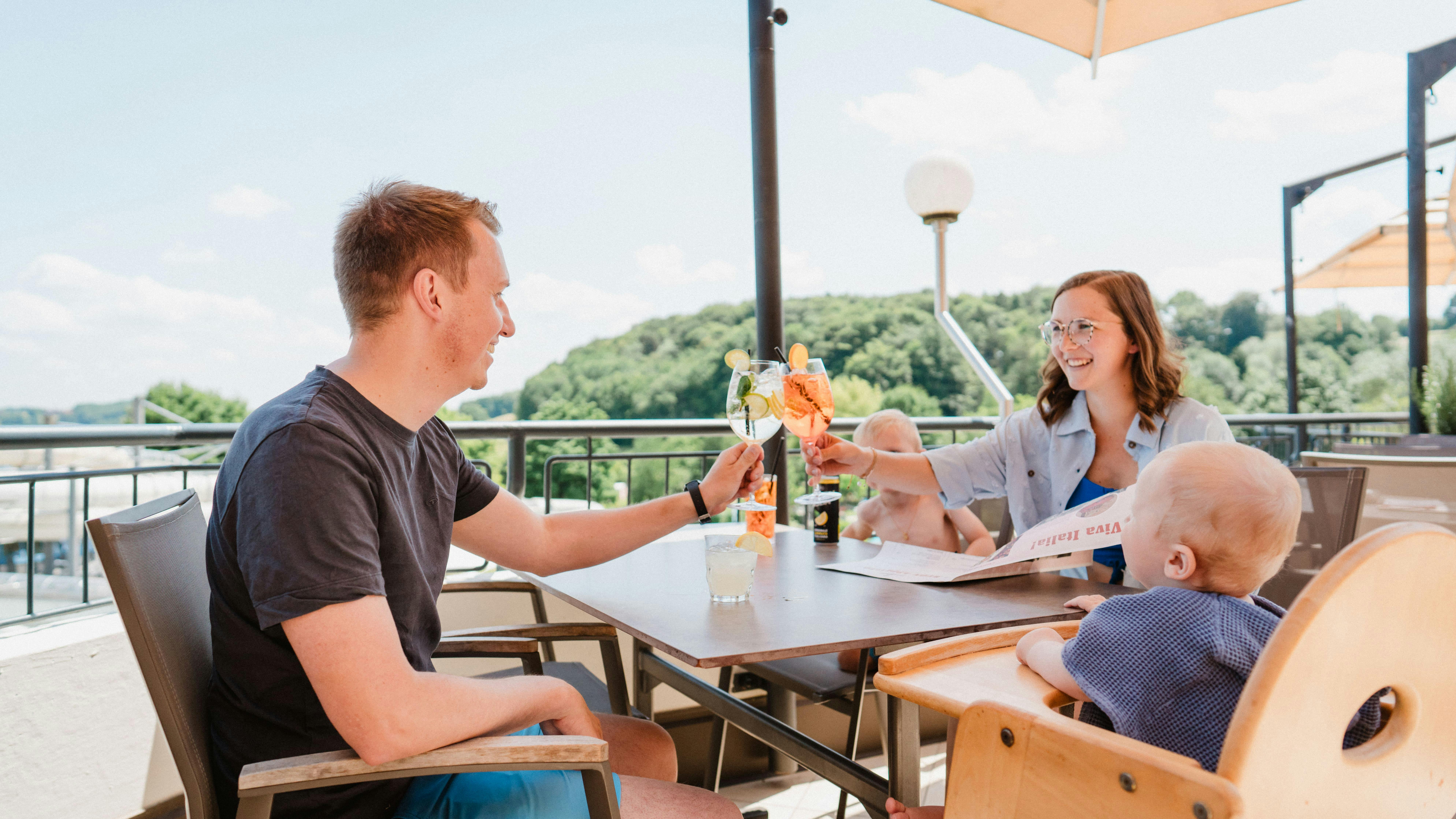 A family enjoys the sun on the Don Camillo terrace.